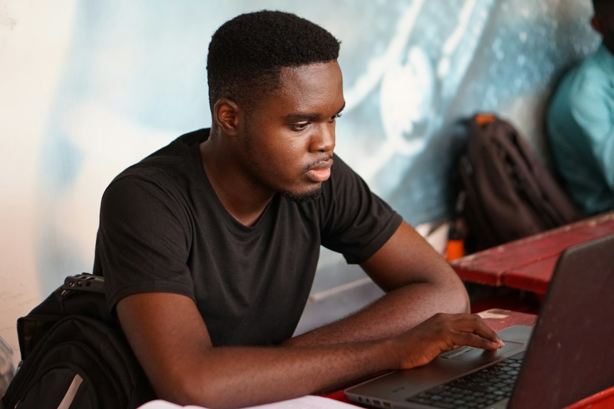 Student concentrating on his laptop